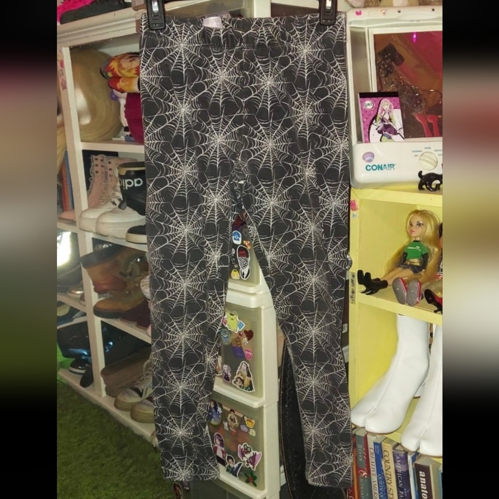Spiderwebs on black leggings